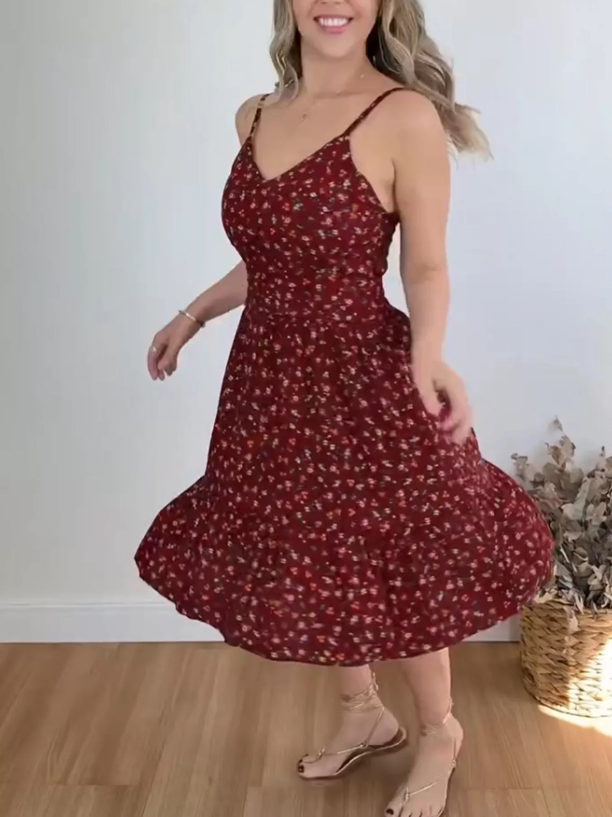 Floral print spaghetti strap ruffle hem midi dress by Plush Fashion Hub, showing the flowy fabric and detailed ruffle design.