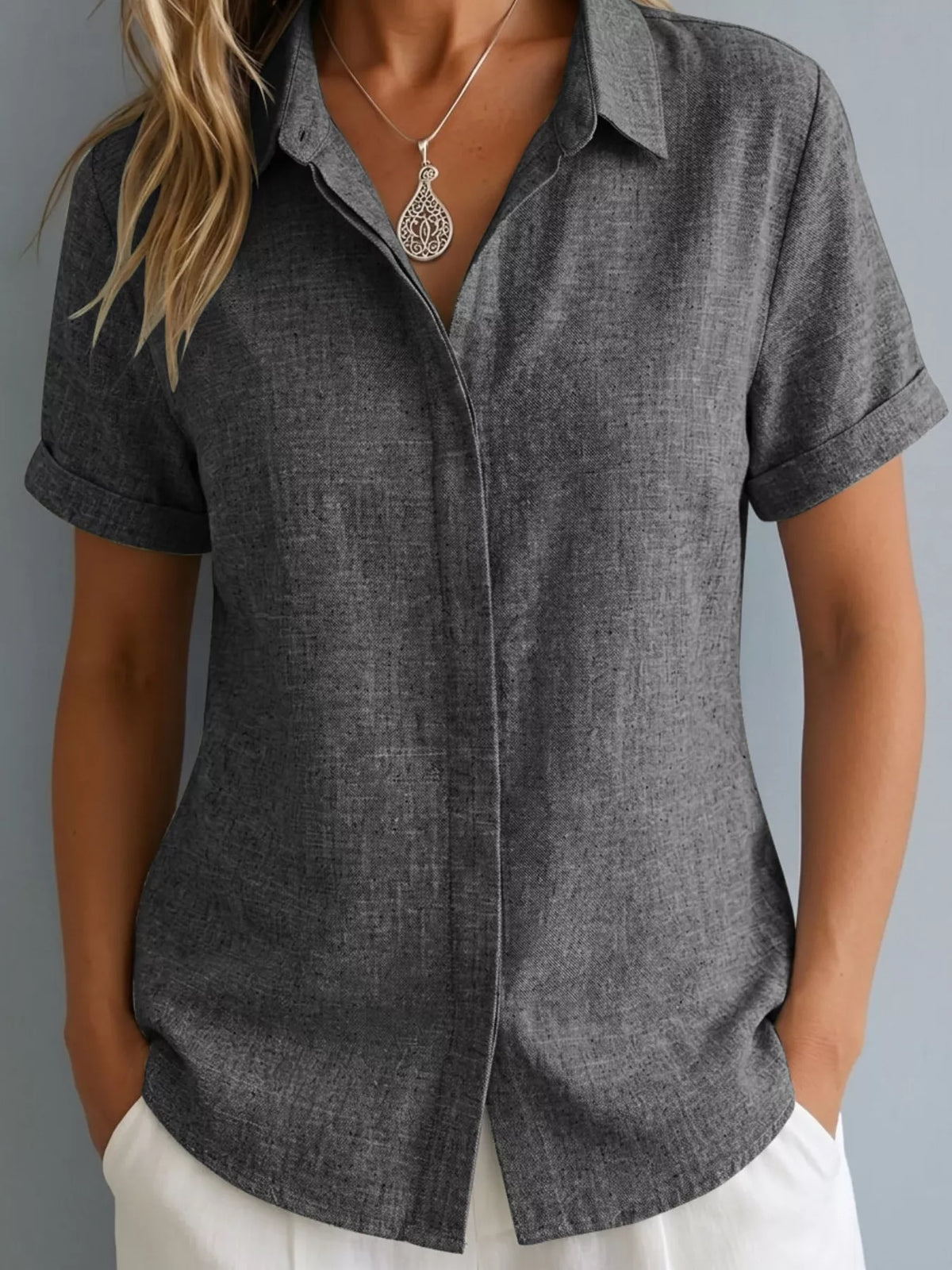 Plus size collared short sleeve shirt from Trendsi, featuring a stylish full-size top with a classic collar and short sleeves.