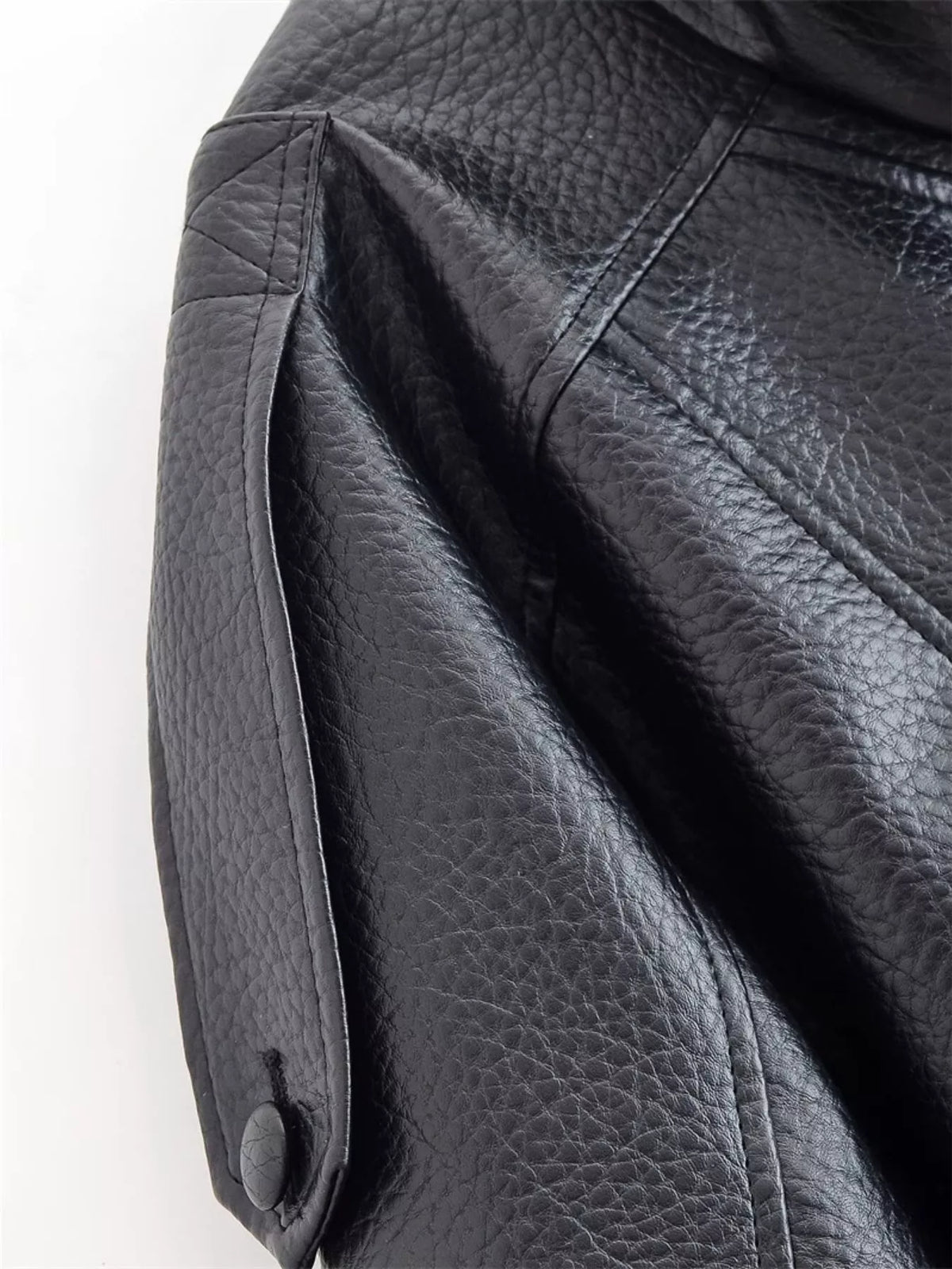 Trendsi women's asymmetrical faux leather moto jacket with stylish design and silver zipper details, displayed on a hanger.