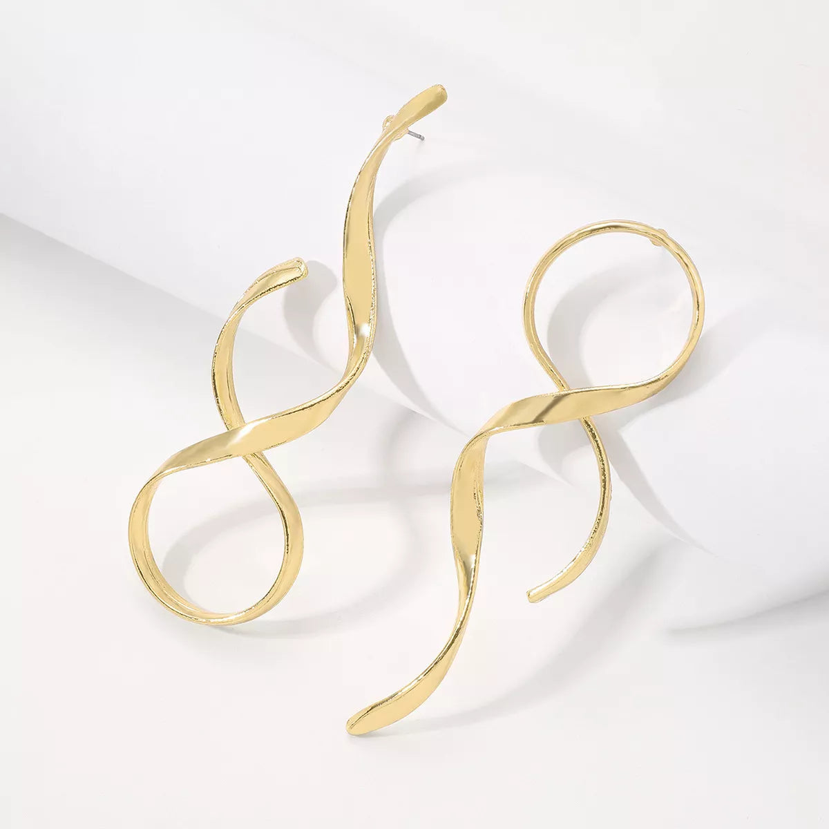Plush Fashion Hub alloy spiral drop earrings with a sleek, modern design, hanging gracefully against a neutral background.