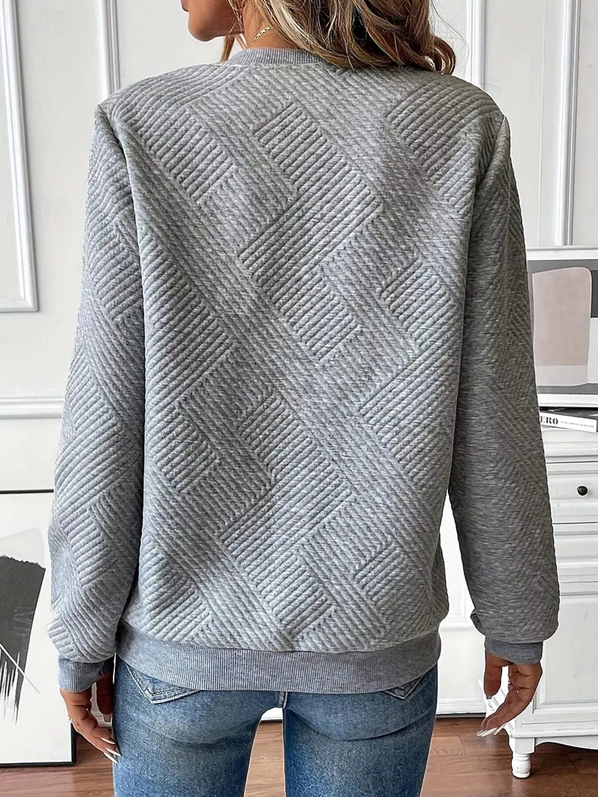 Textured women's quarter-zip sweatshirt by Trendsi, showing the cozy fabric and stylish fit in a casual, versatile design.