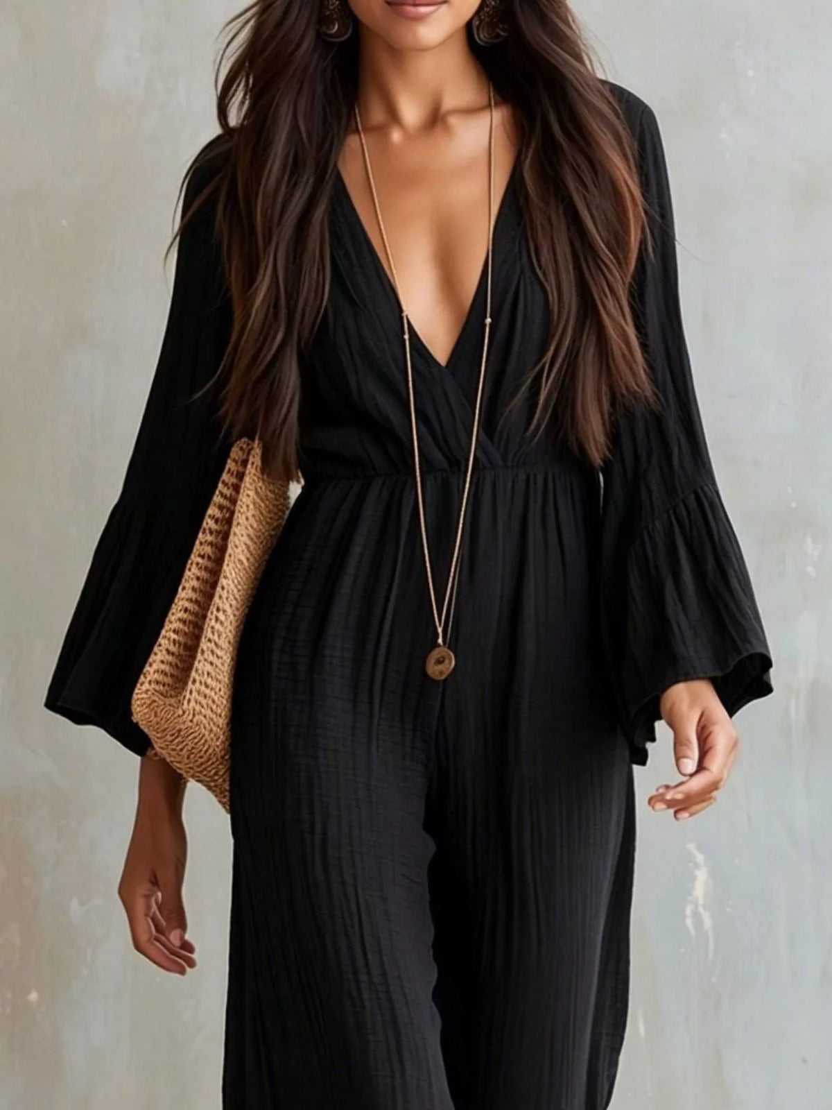 Textured flare sleeve jumpsuit for women by Trendsi, showing the stylish design and fabric details in the image.
