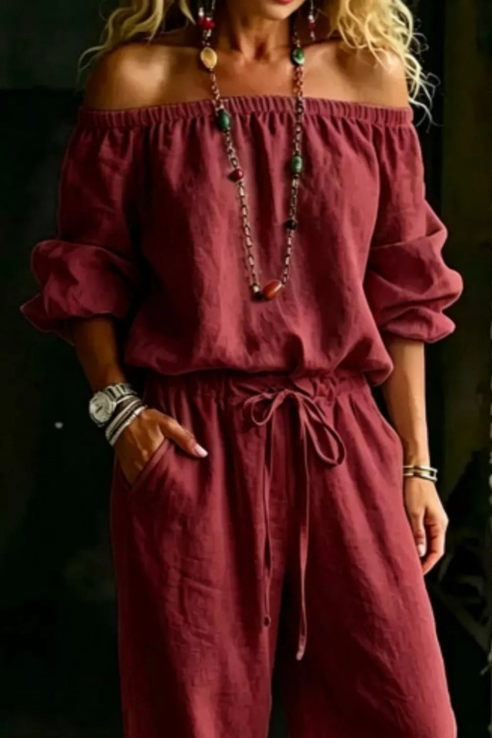 Plus size off-shoulder top and pants set by Trendsi, featuring a stylish, coordinated outfit with a relaxed fit and trendy design.