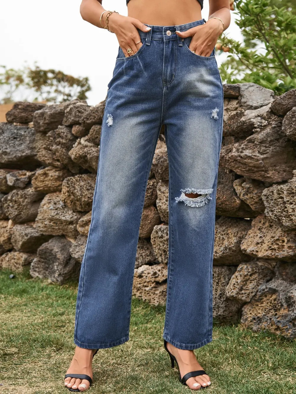 Distressed Plush Fashion Hub denim jeans with front and back pockets, casual fit, and ripped details for a trendy look.