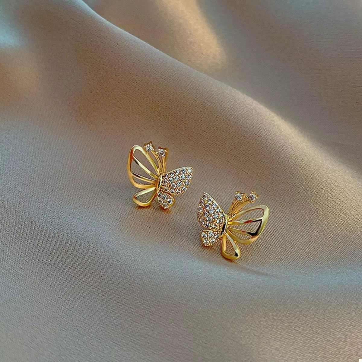 18K gold-plated butterfly stud earrings with delicate design, perfect for daily wear and elegant accessories.