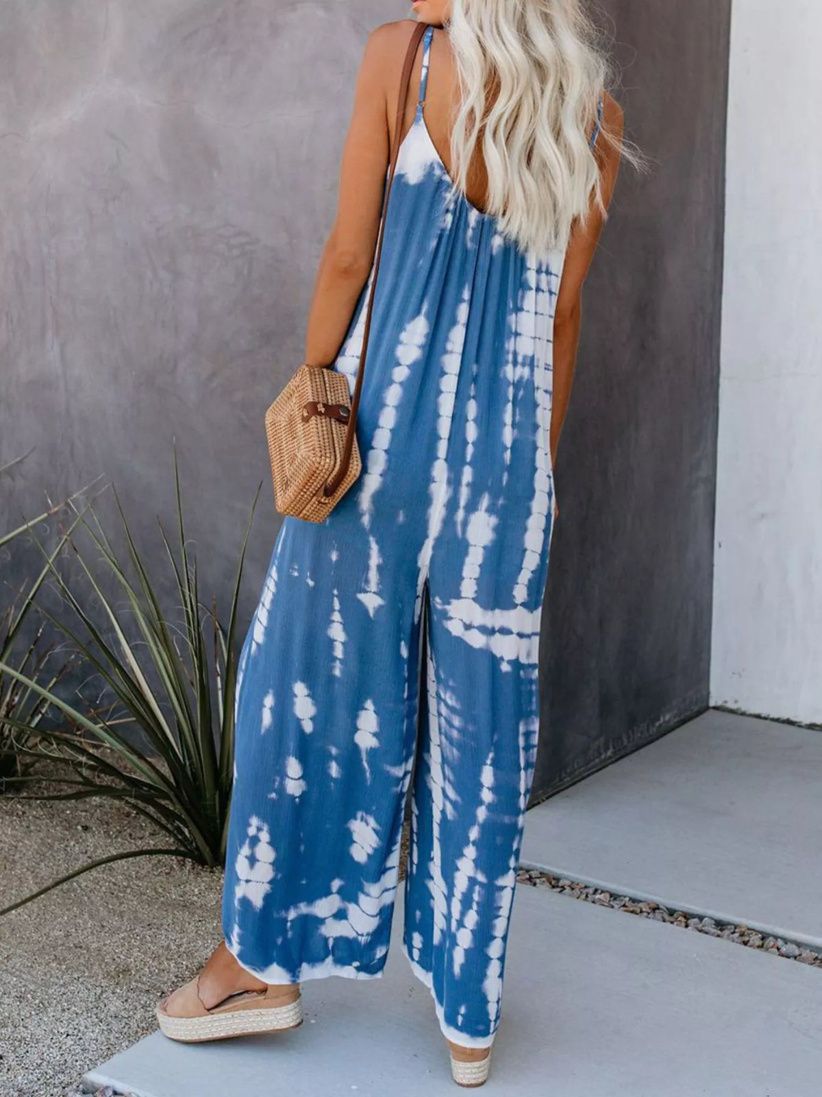 Full size tie-dye wide-leg jumpsuit by Plush Fashion Hub, showcasing vibrant colors and relaxed fit in a stylish plus-size design.