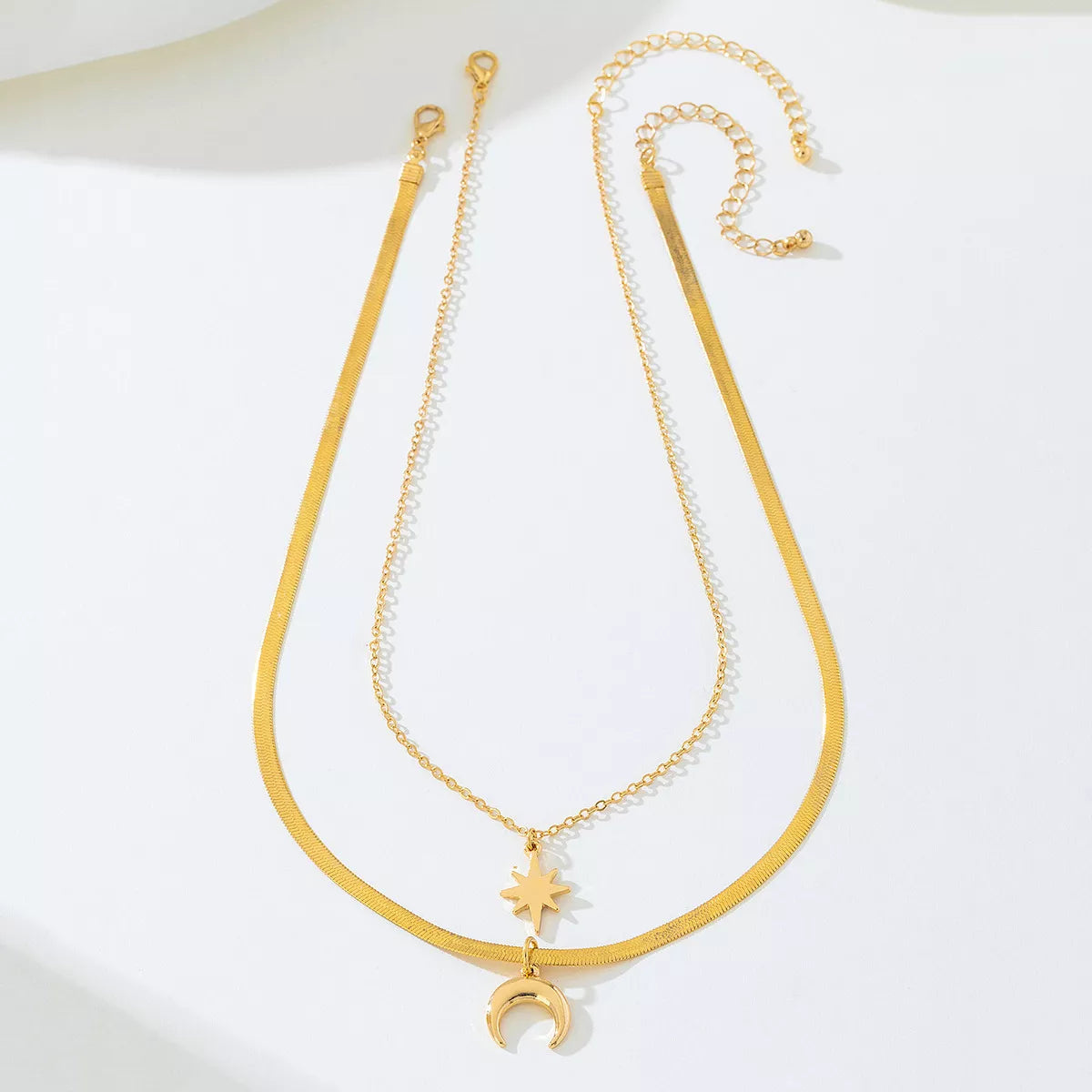 18K gold-plated moon and star necklaces set by Plush Fashion Hub, featuring delicate celestial pendant designs.