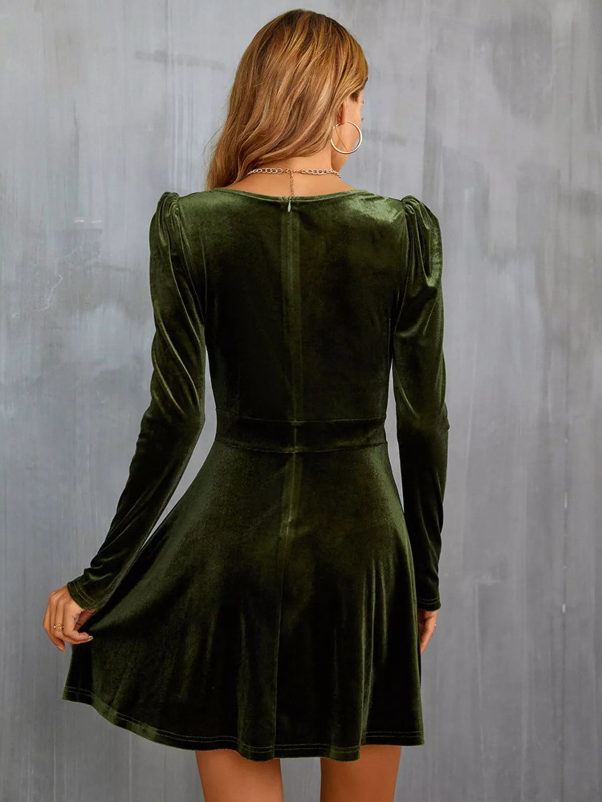 Velvet long sleeve A-line mini dress by Trendsi featuring a fitted waist and soft fabric, shown on a model.