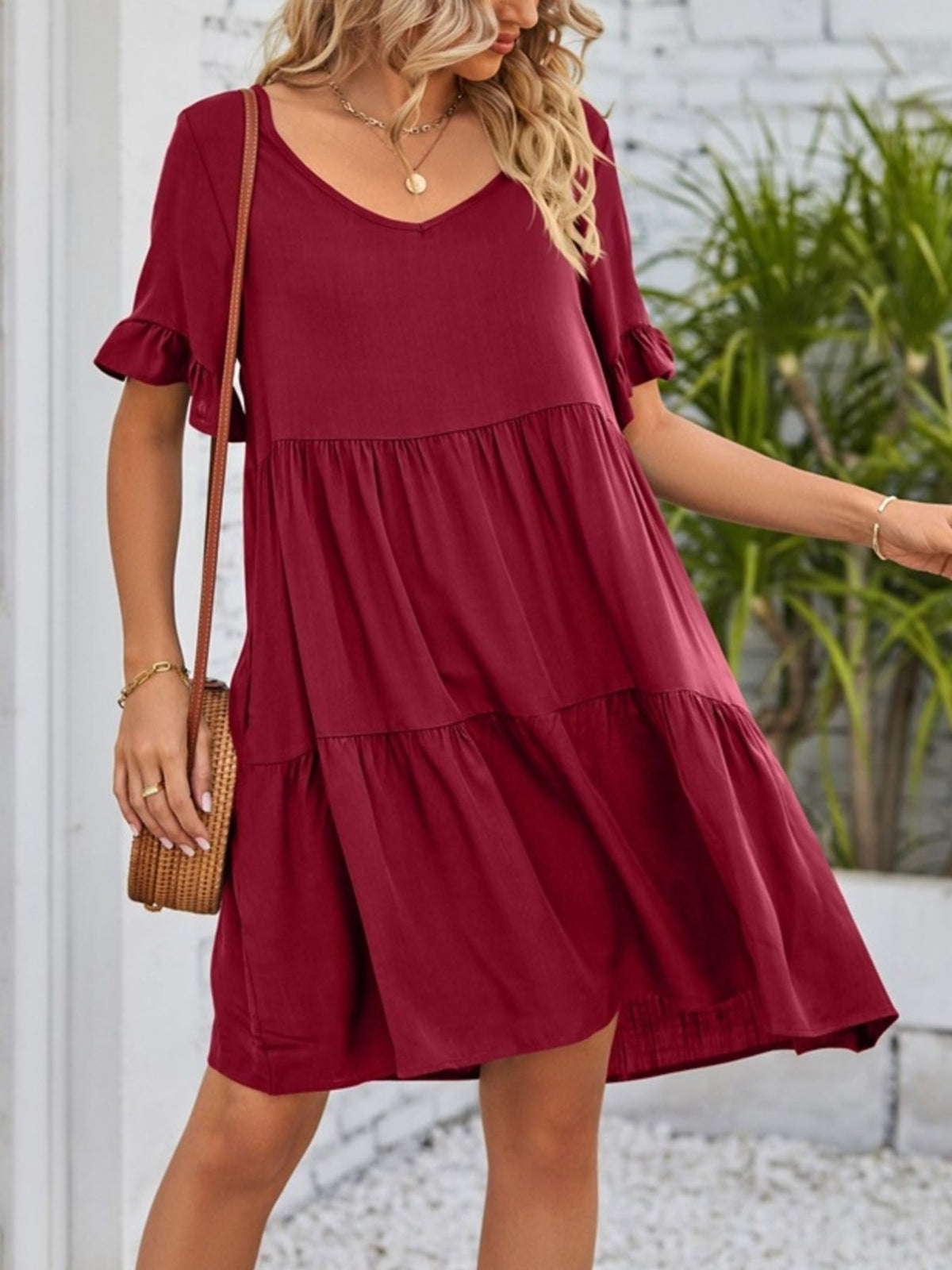 Lightweight rayon mini dress with ruffled sleeves, tiered design, and pockets by Plush Fashion Hub, perfect for casual summer wear.