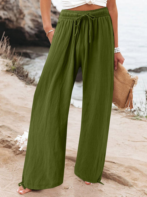 Plus size full-length drawstring wide leg pants by Trendsi, showing relaxed fit and comfortable fabric in natural position.
