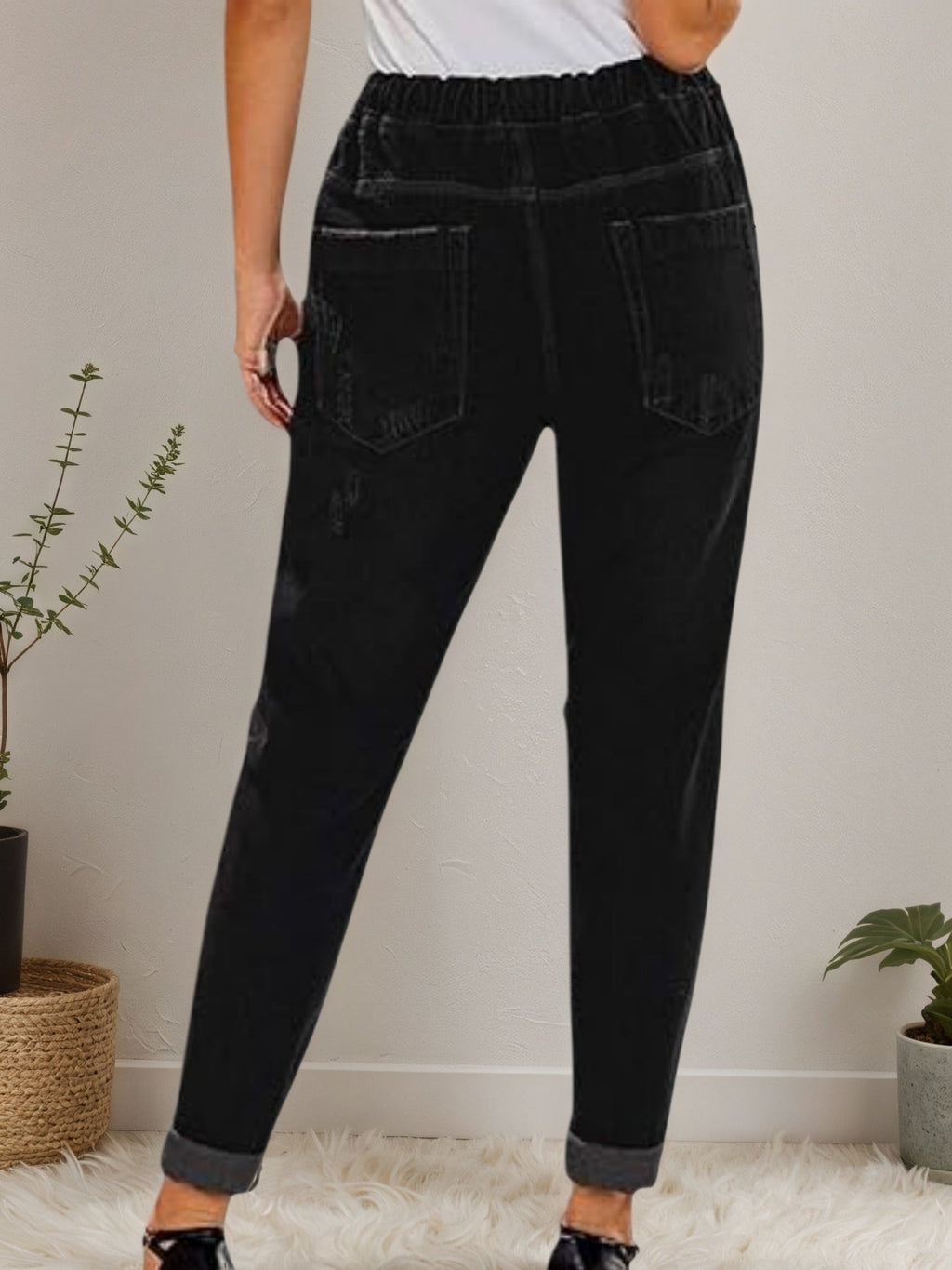 Women’s distressed stretch denim joggers with casual elastic waist from Plush Fashion Hub, featuring a relaxed fit and distressed details.