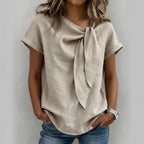 Women's loose-fit short sleeve casual pullover T-shirt by FitiqueFit, shown in a relaxed fit with a soft fabric and simple design.