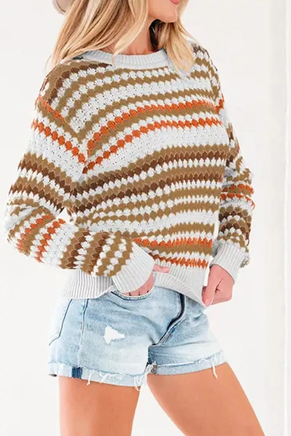 Women's striped geometric pattern sweater by Trendsi, featuring a stylish design with bold stripes and a cozy fit.