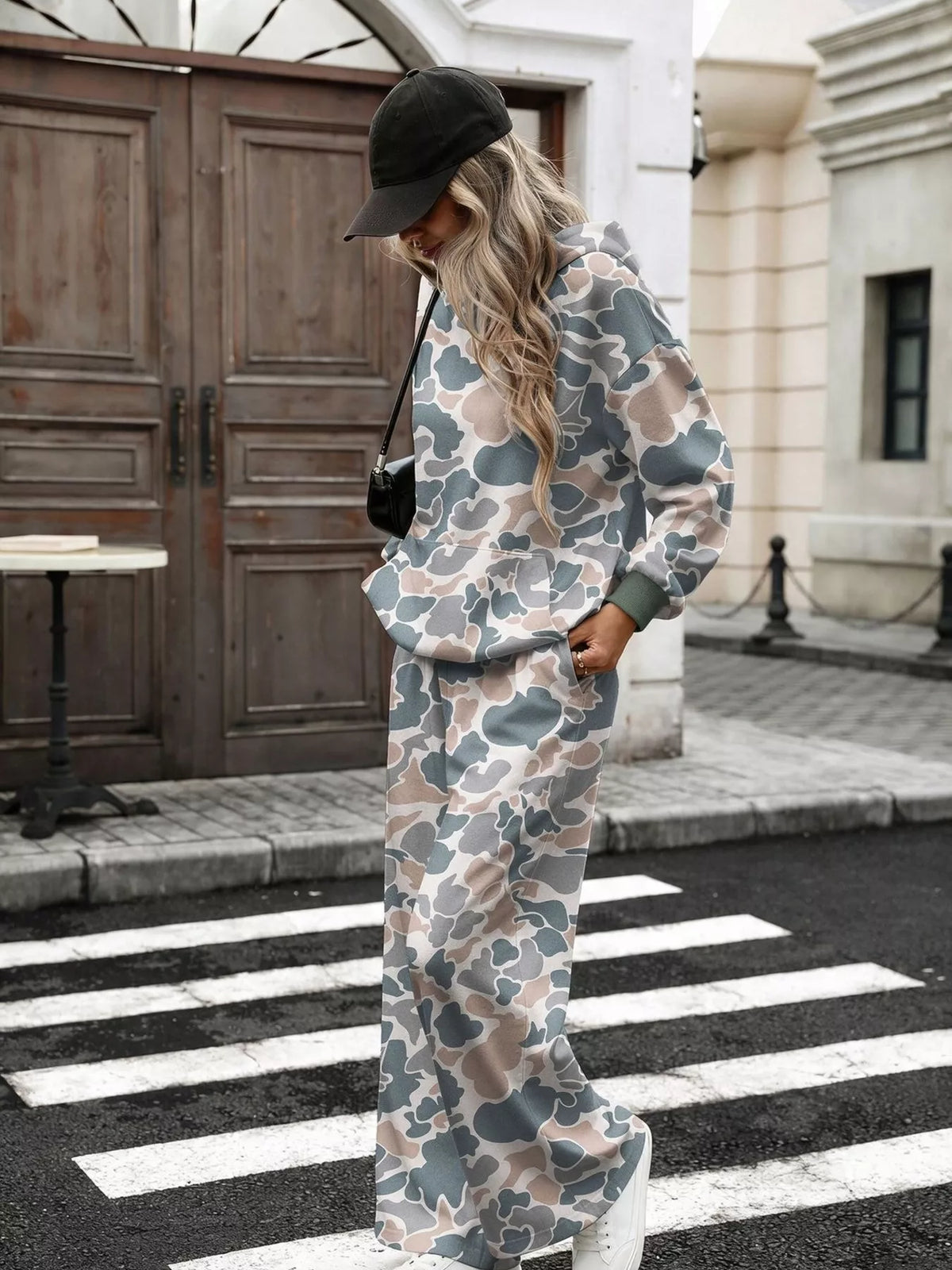 Printed long sleeve hoodie and pants set by Trendsi, featuring a comfortable matching outfit with a bold graphic design.
