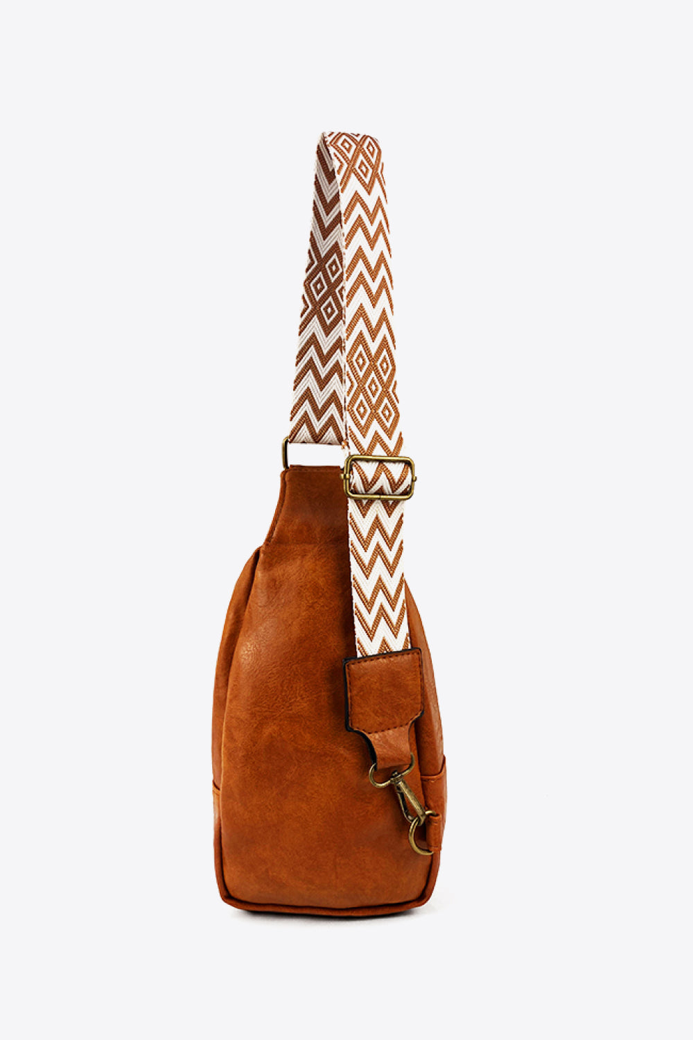 Trendsi random pattern adjustable strap PU leather sling bag with a stylish design and spacious interior.