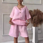 Cotton-linen shirt set with high-waisted loose shorts for women, featuring a casual, breathable top and comfortable bottom.