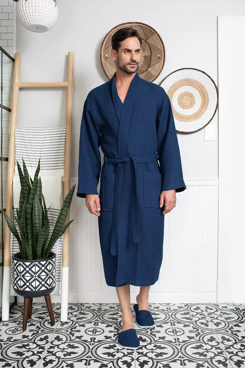 Cotton waffle spa bathrobe for men by Lotus Linen, lightweight and absorbent, shown hanging on a hook.