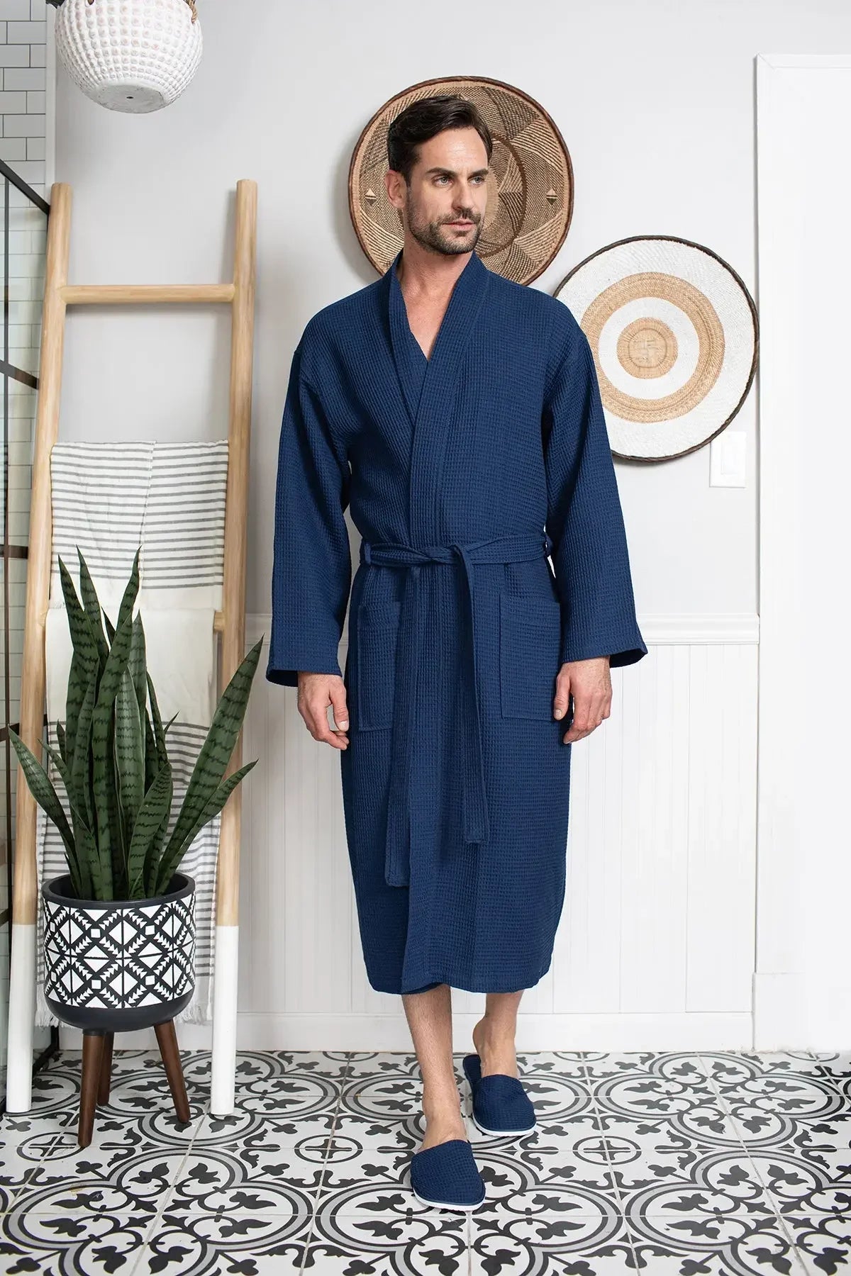 Cotton waffle spa bathrobe for men by Lotus Linen, lightweight and absorbent, shown hanging on a hook.