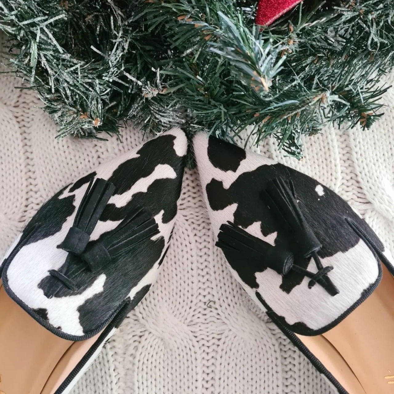 Cow print tassel pumps for women in casual slip-on style by FitiqueFit, featuring a playful cow pattern and decorative tassels.