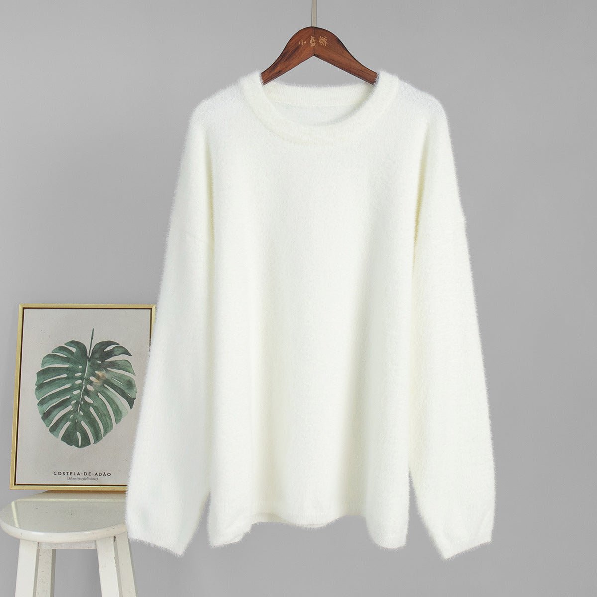 Plush Fashion Hub crew neck pullover sweater in solid color, featuring a loose fit, suitable for autumn and winter casual wear.