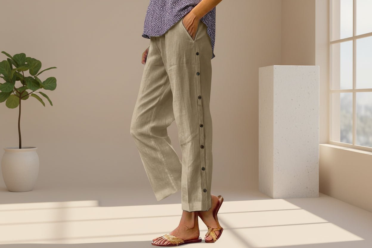 FitiqueFit casual cropped pants with decorative buttons along the side seams, showcasing a stylish and modern design.
