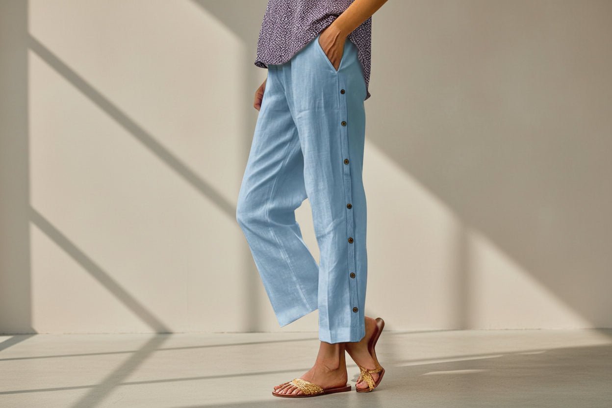 FitiqueFit casual cropped pants with decorative buttons along the side seams, showing a stylish and comfortable fit.