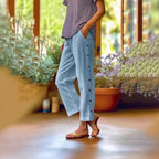 FitiqueFit casual cropped pants with decorative buttons along the side seams, showcasing a stylish and comfortable design.