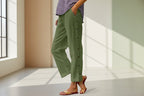 FitiqueFit casual cropped pants with decorative buttons along the side seams, showcasing a stylish and modern design.