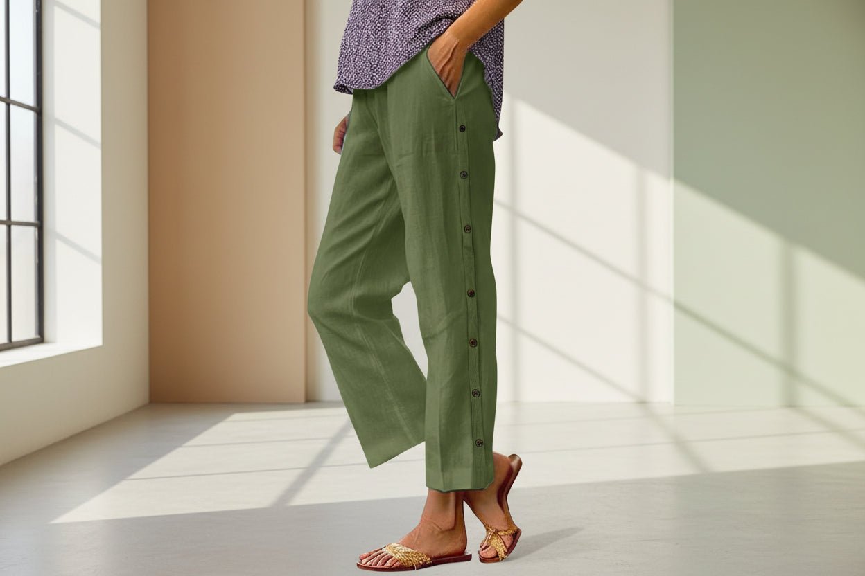 FitiqueFit casual cropped pants with decorative buttons along the side seams, showcasing a stylish and modern design.