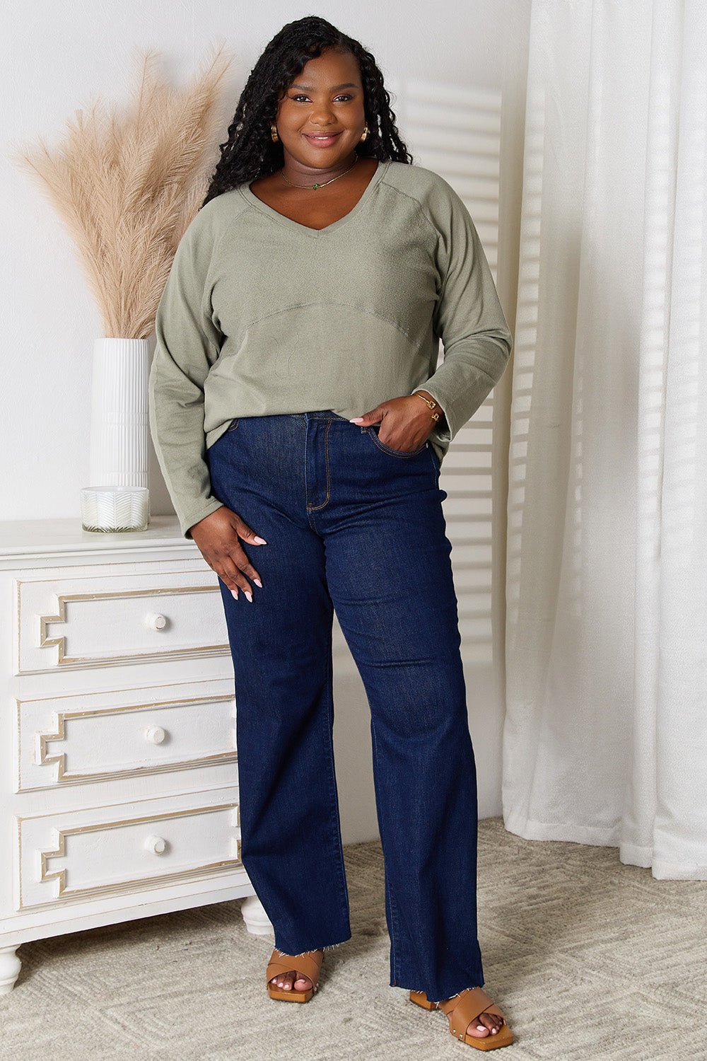Women’s V-neck long sleeve cotton blend T-shirt by Plush Fashion Hub, displayed on a model, in a casual and comfortable style.