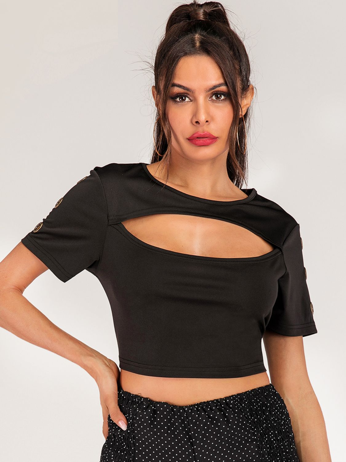 Women’s short sleeve cropped tee with grommet cutout details, edgy fashion top by Plush Fashion Hub, casual and trendy women’s apparel.