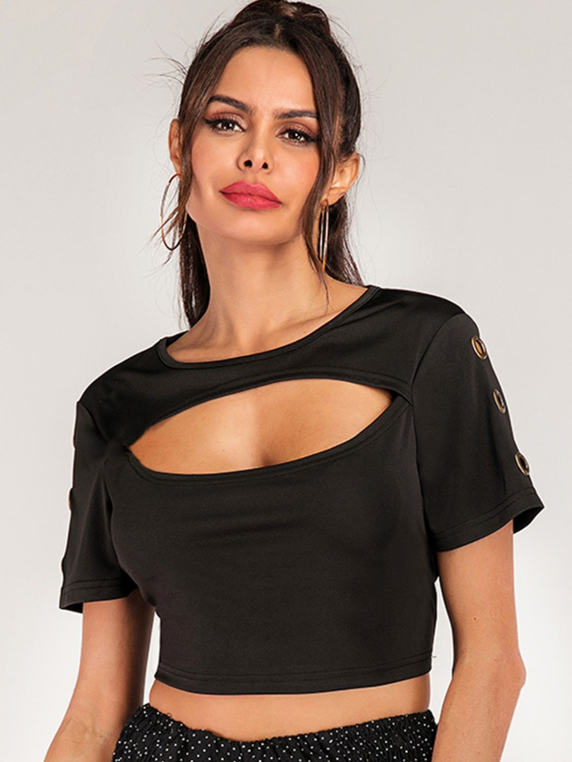 Women’s short sleeve cropped tee with grommet cutout details, edgy fashion top by Plush Fashion Hub.