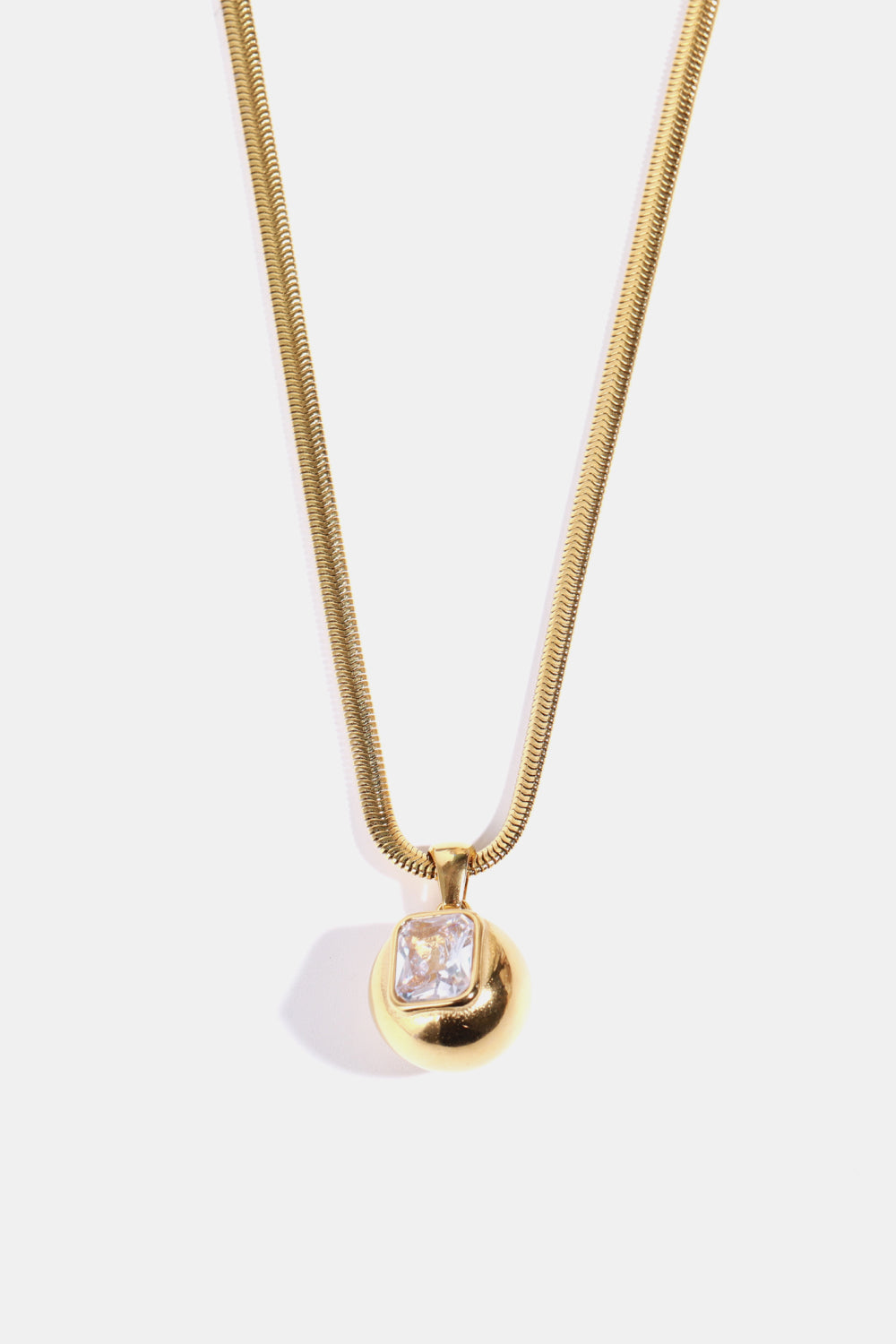 Gold-plated geometrical zircon pendant necklace with sleek design, featuring sparkling zircon stones on a fine chain.