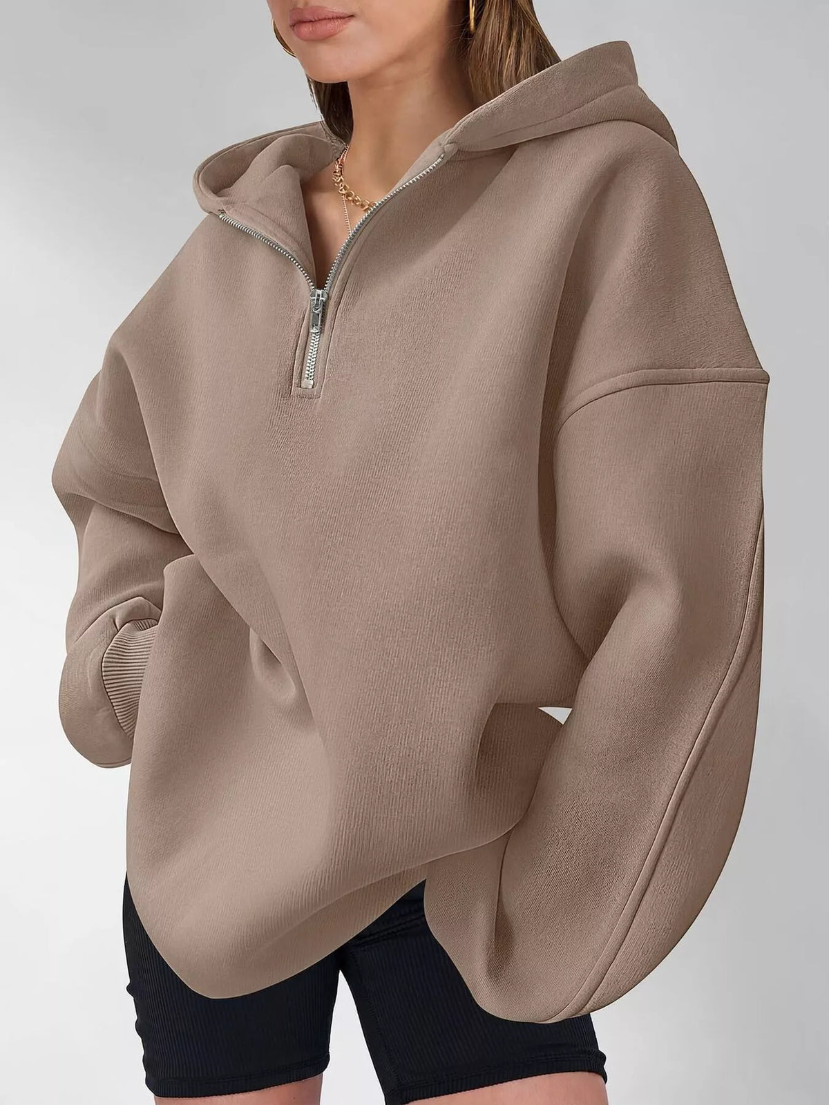 Oversized quarter-zip hoodie from Trendsi, casual tops with a relaxed fit and soft fabric, featuring a half-zip front and comfortable design.