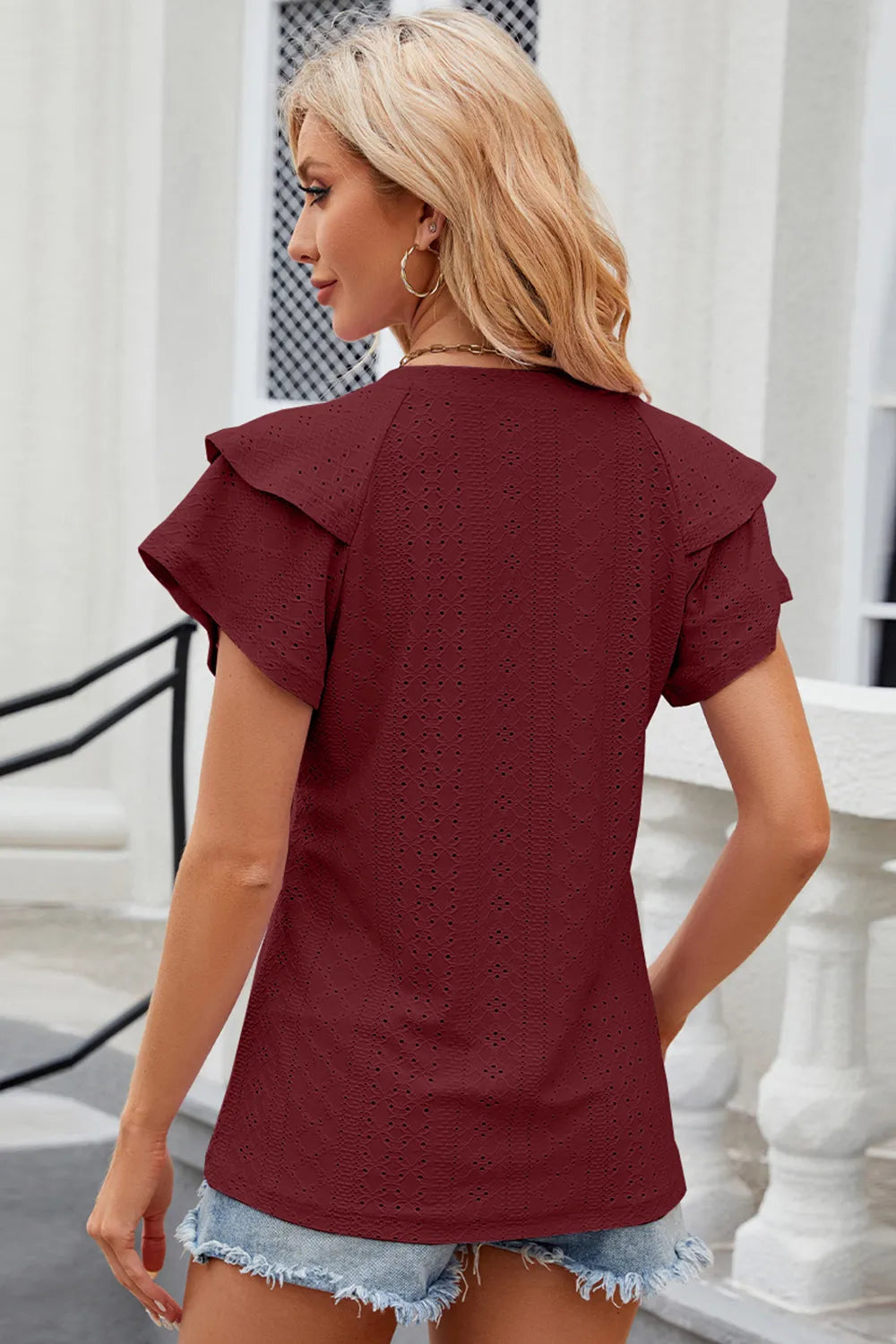 Pink eyelet notched flutter sleeve t-shirt from Plush Fashion Hub, showing detailed flutter sleeves and eyelet design.