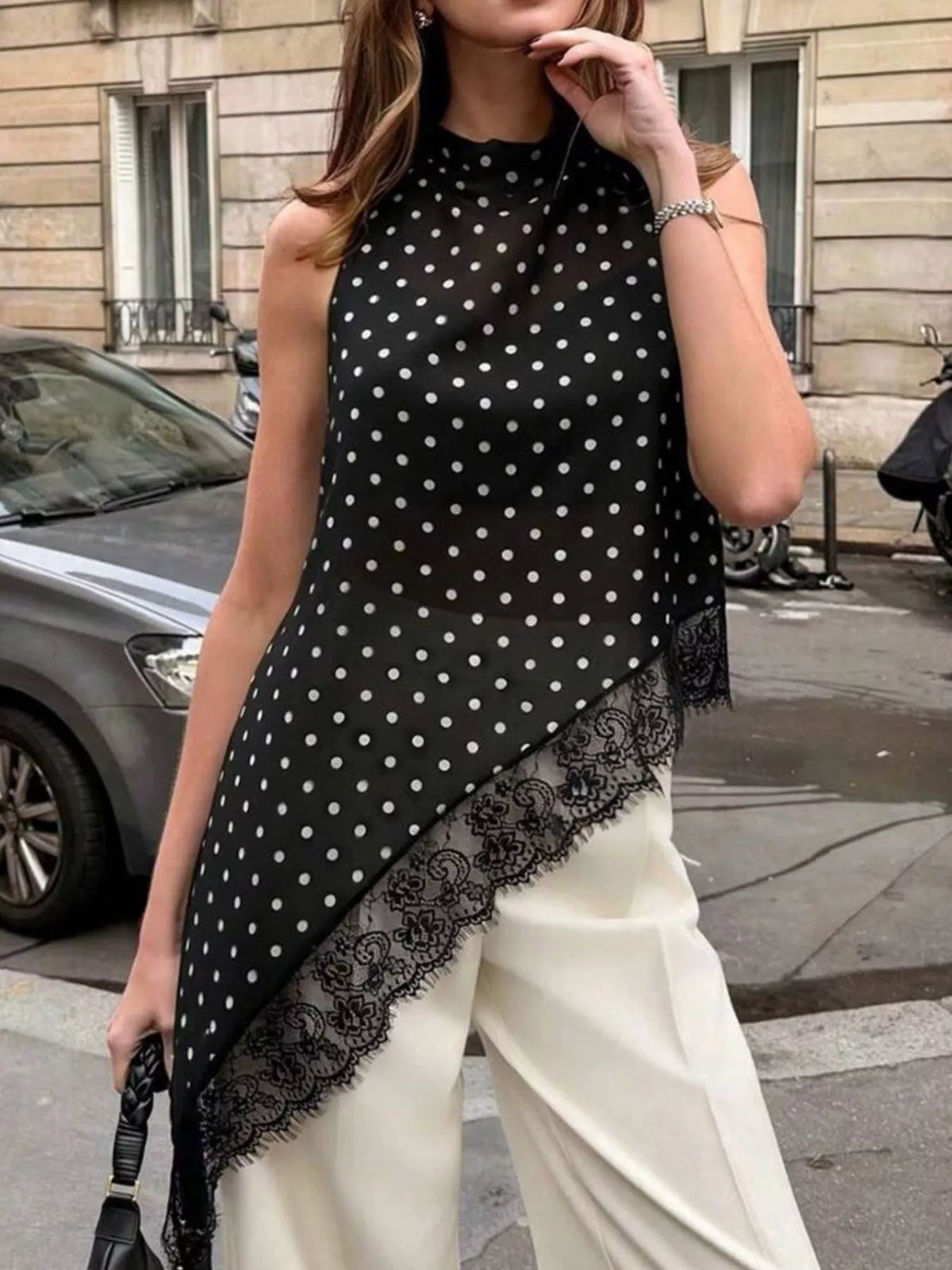 Polka dot lace trim sleeveless blouse with asymmetrical hem from Plush Fashion Hub, featuring a stylish and feminine shirt design.