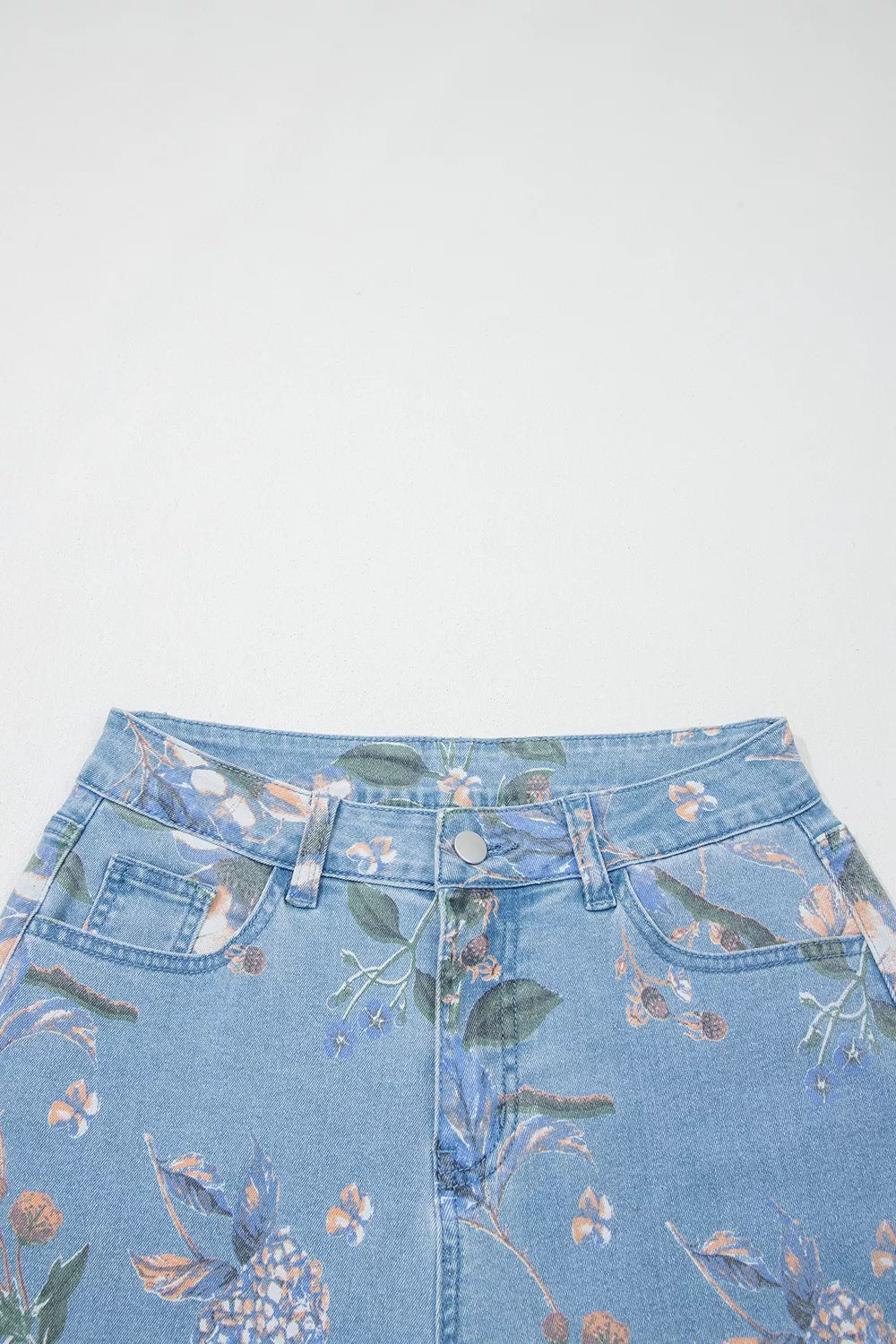 Floral print wide-leg jeans by Trendsi featuring a relaxed fit and vibrant floral pattern, casual and stylish for everyday wear.