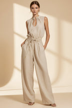 Women's sleeveless high-waist wide-leg pleated jumpsuit from Plush Fashion Hub, casualwear, shown in a natural pose and fabric detail.