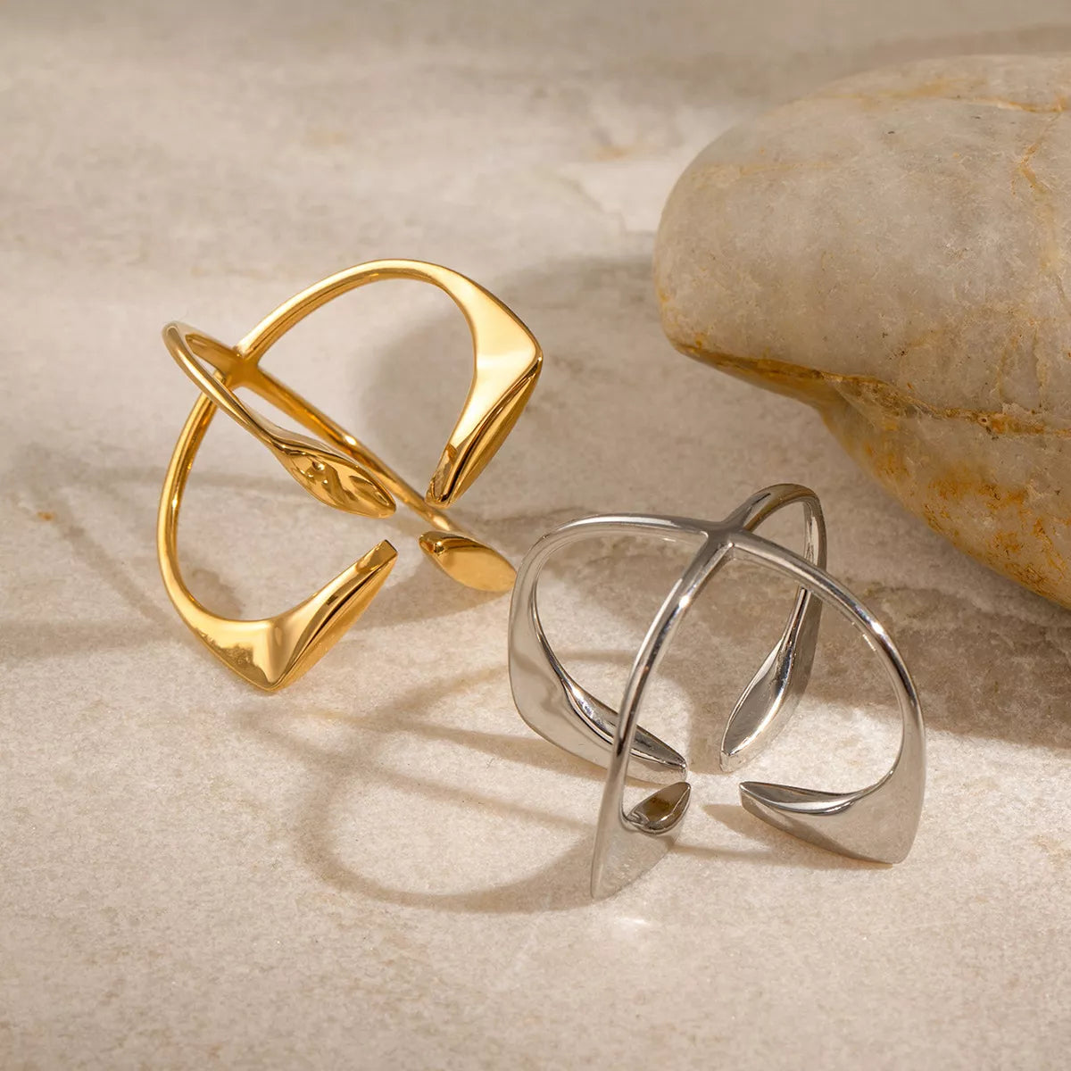 Stainless steel crisscross open ring from Plush Fashion Hub, featuring a sleek, modern design with intersecting bands.