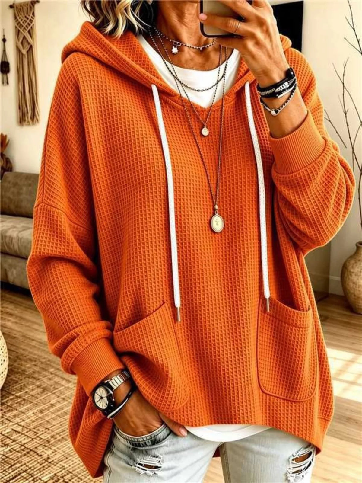 Plus size women's waffle knit hoodie with pockets from Trendsi, featuring a cozy, full-coverage design and comfortable fit.