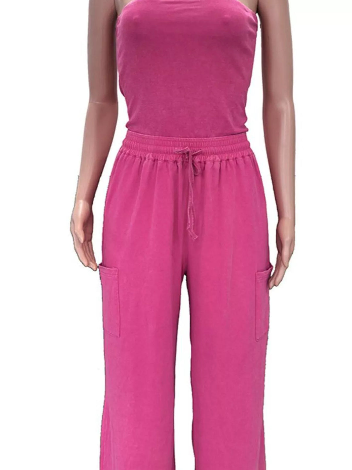 Strapless wide-leg jumpsuit with drawstring waist in black, featuring a relaxed fit and trendy design by Trendsi.