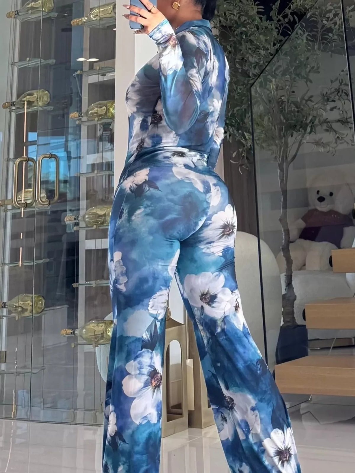 Printed mesh shirt and pants set for women by Trendsi, featuring a stylish, breathable mesh fabric and coordinated design.