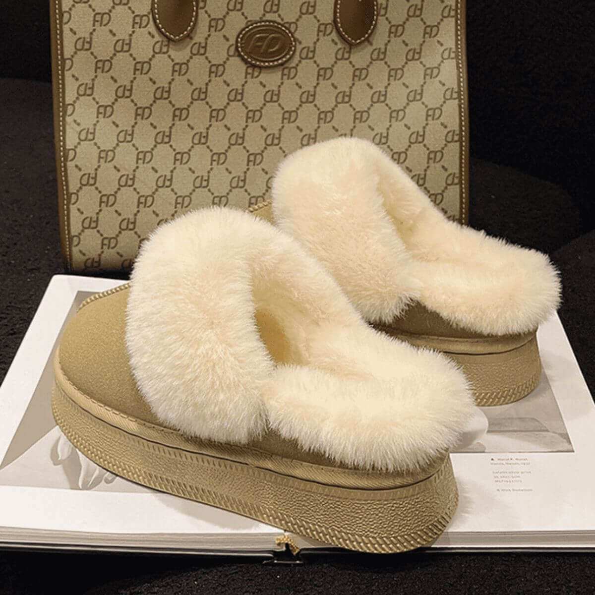 Suede soft round toe platform slippers with faux fur and rubber sole.