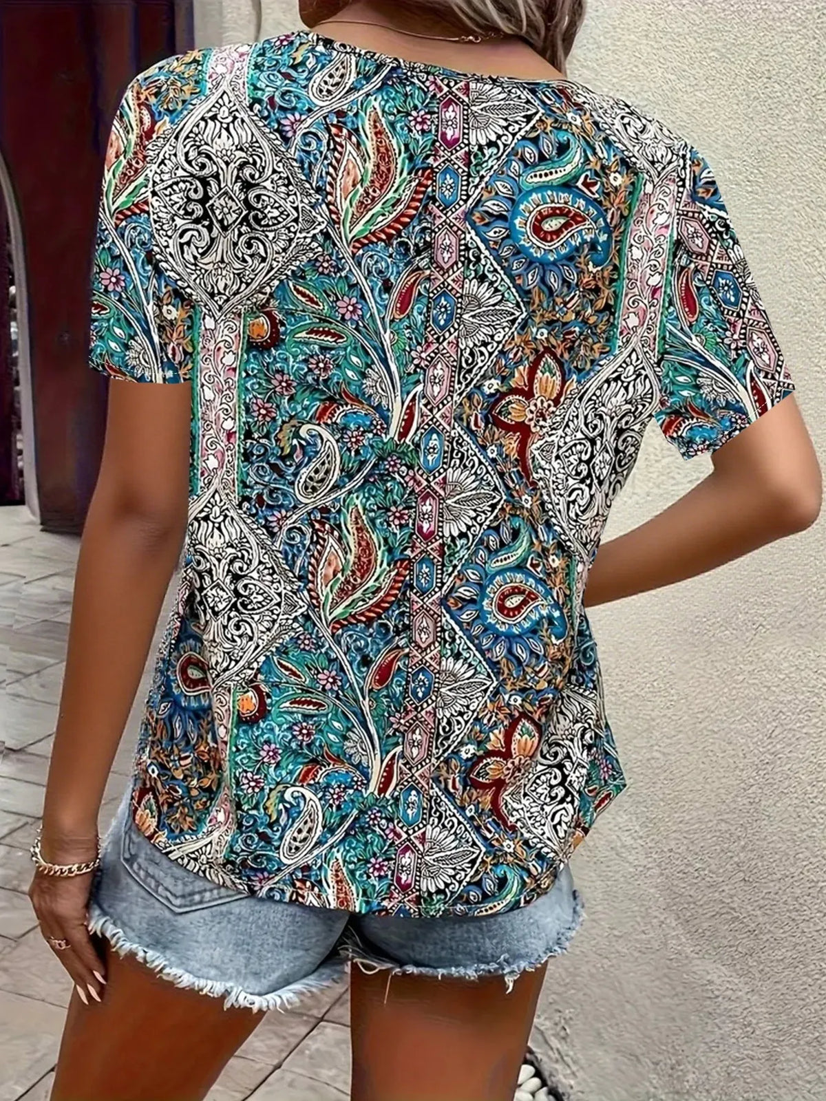Bohemian Paisley V-neck short sleeve T-shirt by Plush Fashion Hub with vibrant paisley pattern and comfortable fit.