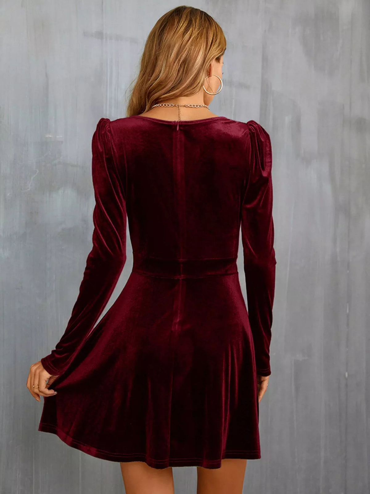 Velvet long sleeve A-line mini dress from Trendsi, featuring a fitted waist and soft fabric, shown on a model.