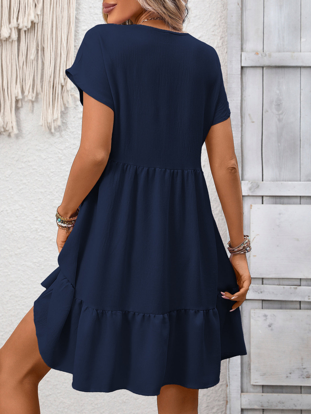 Women's V-neck ruffle hem mini dress with ruched details by Plush Fashion Hub, featuring a stylish and feminine design.