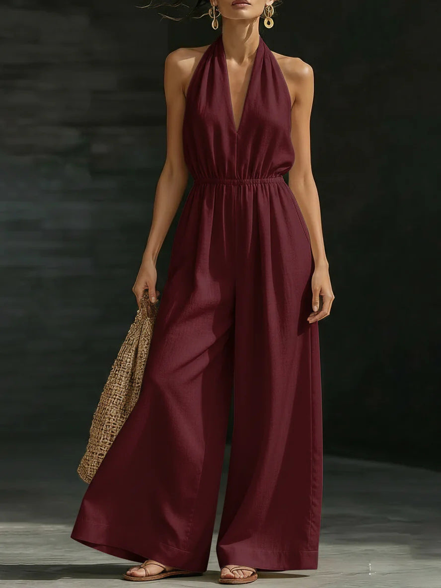 Women’s V-neck halter neck wide-leg jumpsuit by FitiqueFit, casualwear style, shown in a relaxed fit with flowing fabric.