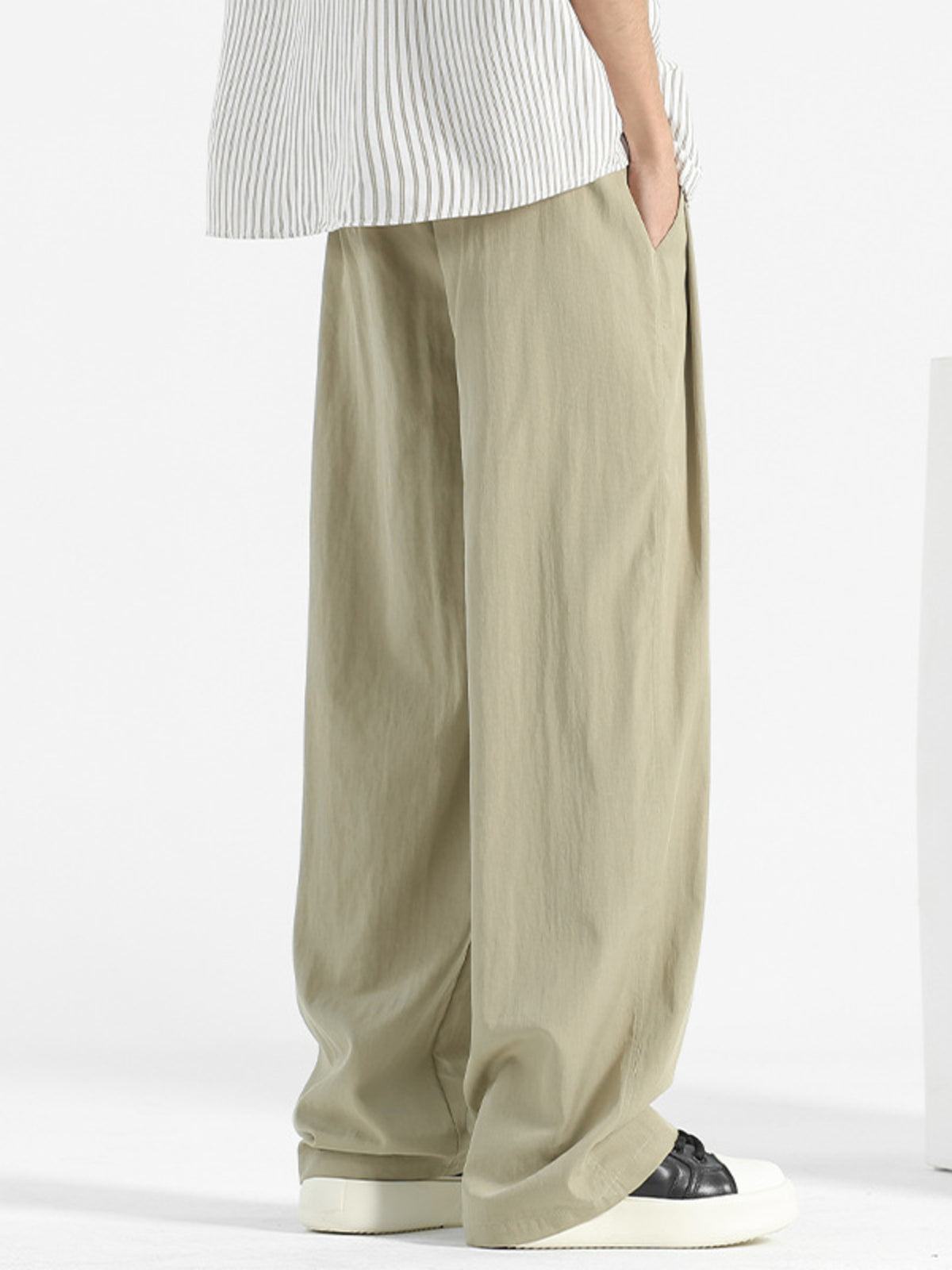 Men's loose fit casual pants with drawstring waist from Plush Fashion Hub, shown in a relaxed, comfortable style.