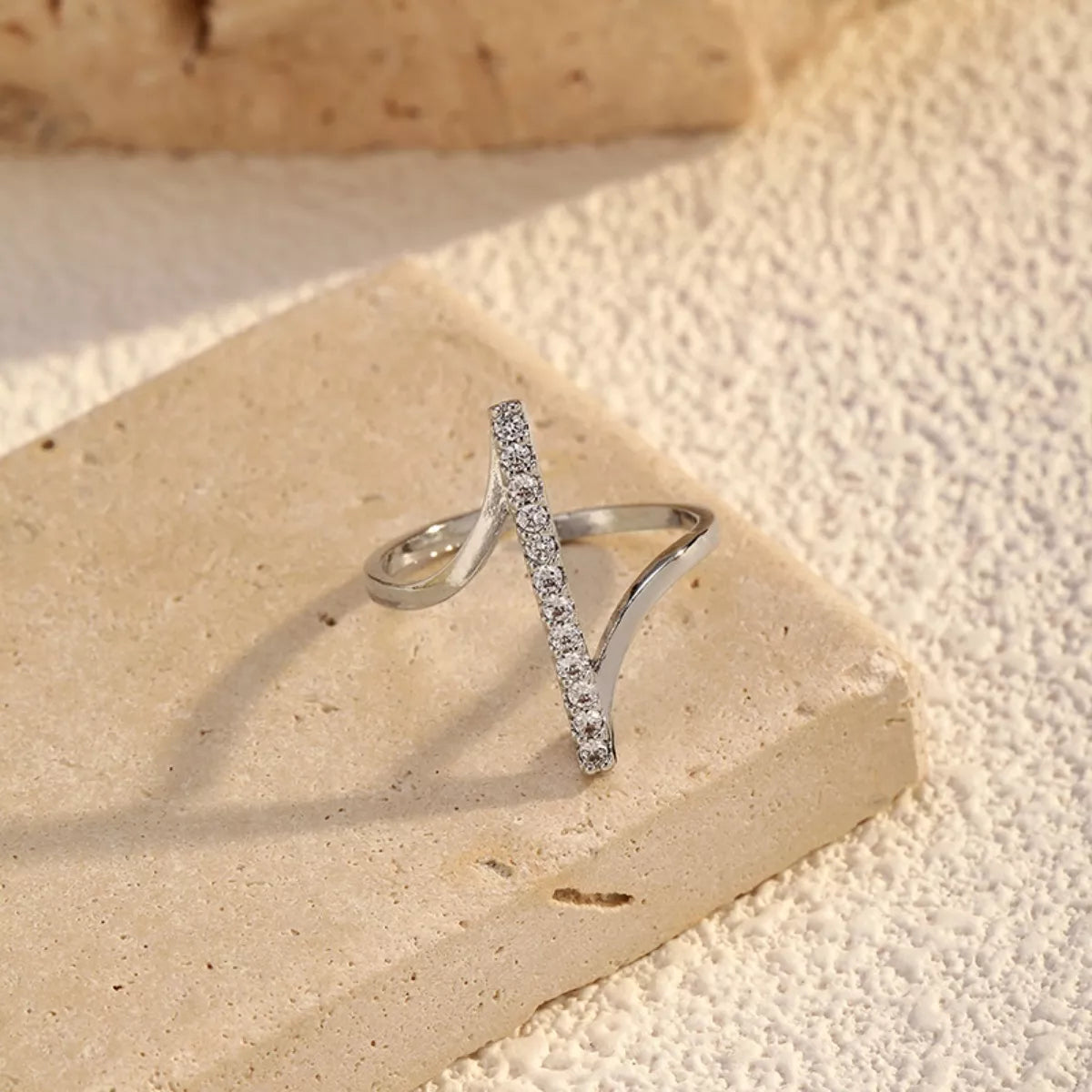 Irregular Rhinestone Ring by Plush Fashion Hub featuring a unique design with sparkling rhinestones on a silver-tone band.