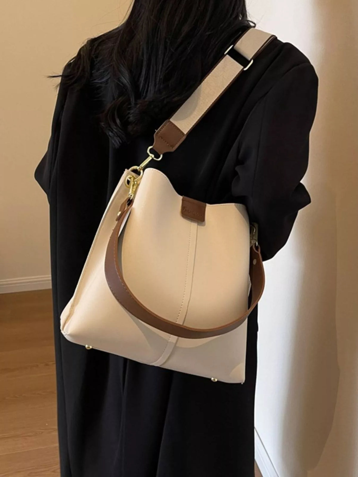 Plush Fashion Hub PU leather crossbody handbag with adjustable strap and sleek design, perfect for casual or evening wear.